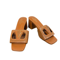 Valentino Garavani VLogo Cut-Out cognac leather block heel sandals, angled pair view