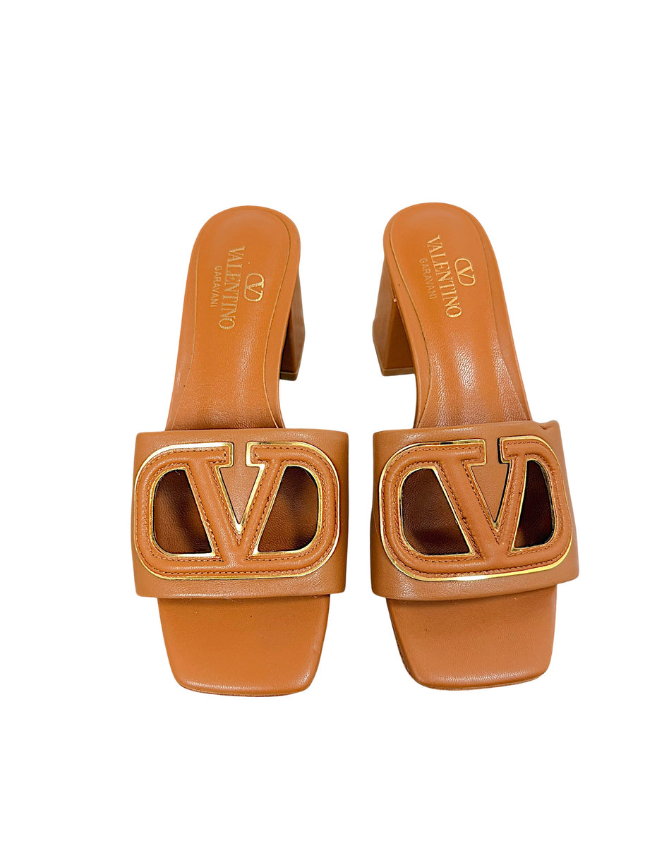 Valentino Garavani VLogo Cut-Out cognac leather sandals with gold-tone logo detail, front view