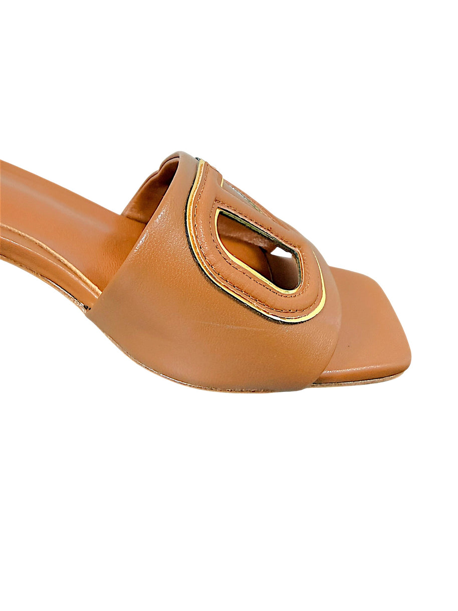 Close-up of Valentino Garavani VLogo Cut-Out with gold-tone trim on cognac leather sandal
