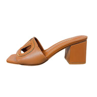 Valentino Garavani leather slide sandal showing VLogo Cut-Out detail and block heel