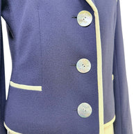 Close-up detail of Valentino blazer mother-of-pearl buttons and ivory piping