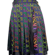Versace FW 2021 high-waisted pleated skirt showing vibrant La Greca geometric print, multicolor VERSACE logo panels and black satin-effect hem.