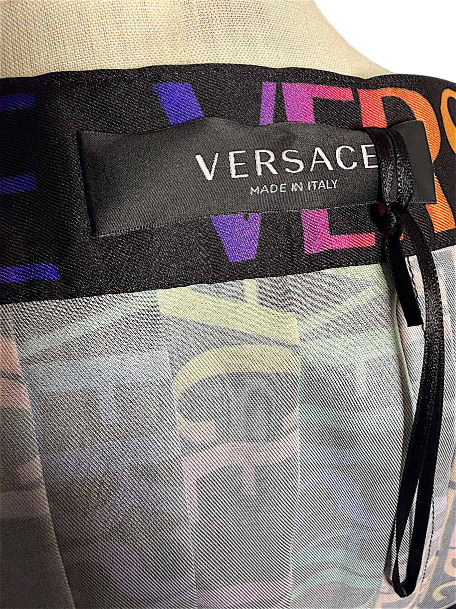 Interior Versace Made in Italy designer label on Fall Winter 2021 La Greca multicolor pleated skirt.