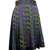 Angled front view of Versace Fall Winter 2021 La Greca skirt with structured A-line pleats, colorful geometric pattern and contrasting black hem.