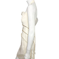 Side profile of Versace Spring 2009 Look 6 ivory fitted dress with halter neckline and gold zippers