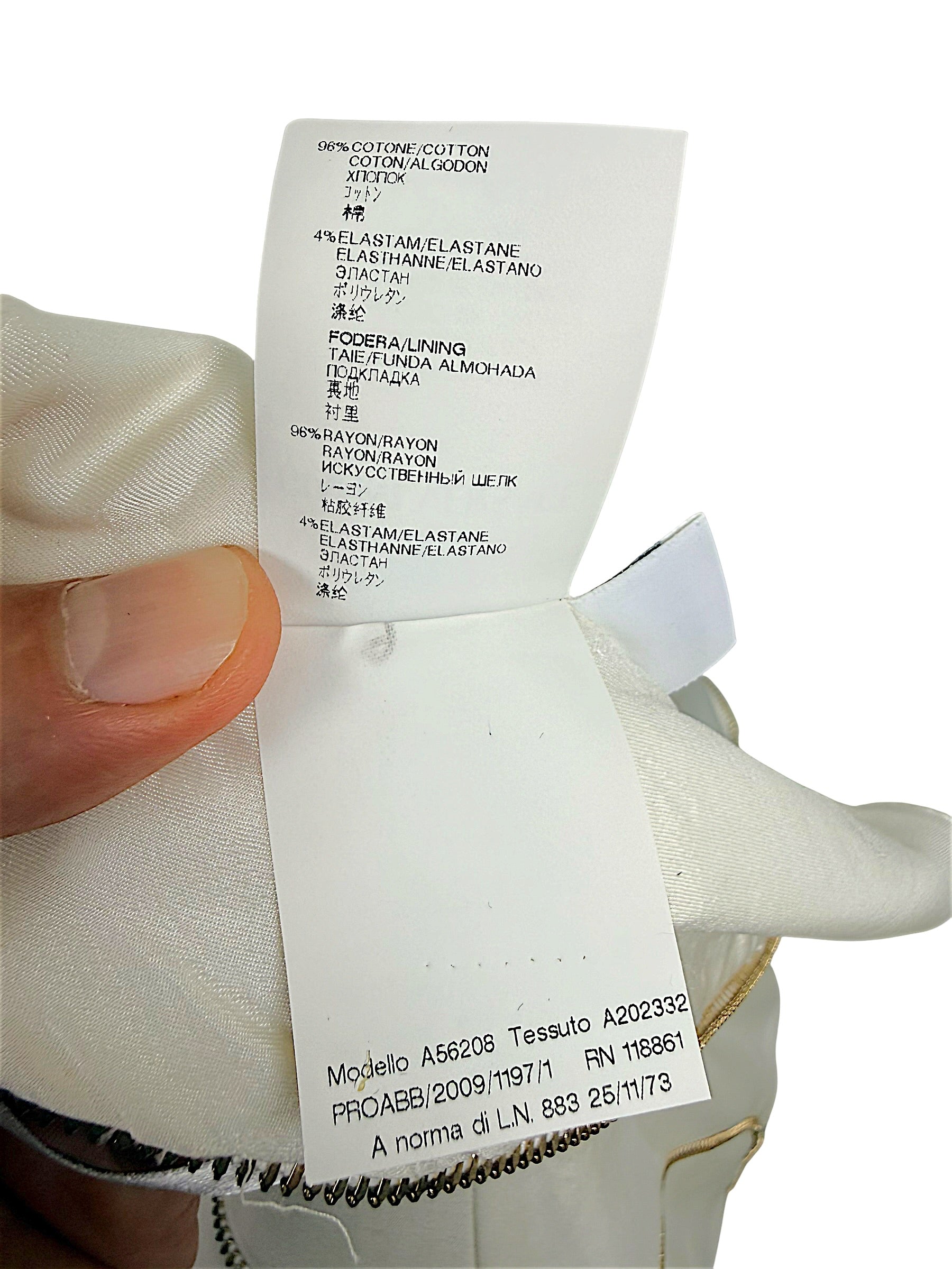 Composition and garment identification label for Versace Spring 2009 ivory dress showing cotton elastane fabric and rayon lining