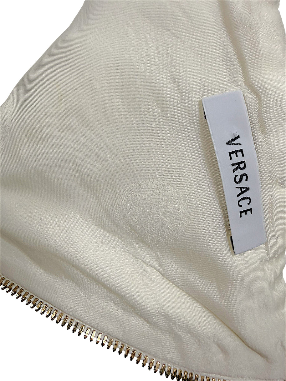 Interior Versace logo label and tonal Medusa lining detail on Spring 2009 ivory runway documented dress