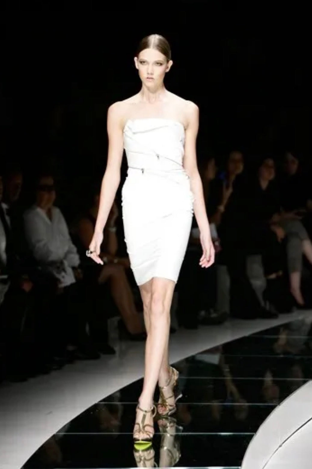 Versace Spring Summer 2009 runway Look 6 showing the original ivory fitted dress with exposed zipper detailing