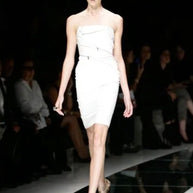 Versace Spring Summer 2009 runway Look 6 showing the original ivory fitted dress with exposed zipper detailing