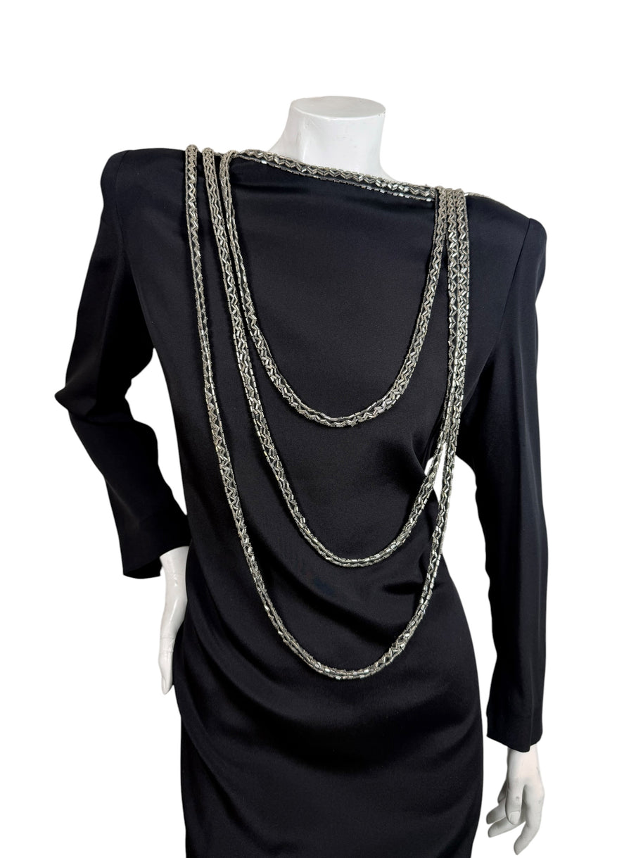 Front detail of vintage Bob Mackie black dress with layered silver bugle bead swags and structured shoulders