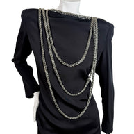 Front detail of vintage Bob Mackie black dress with layered silver bugle bead swags and structured shoulders