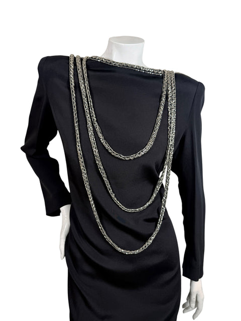 Front detail of vintage Bob Mackie black dress with layered silver bugle bead swags and structured shoulders