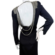 Full back view of vintage 1980s Bob Mackie black dress with dramatic open back and cascading silver bugle bead embellishment