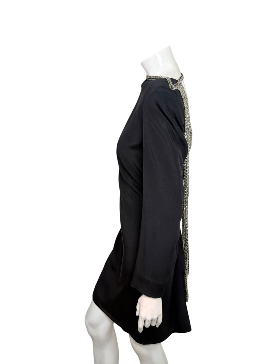 Side view of vintage 1980s Bob Mackie black cocktail dress showing long sleeves and silver beaded open-back detailing