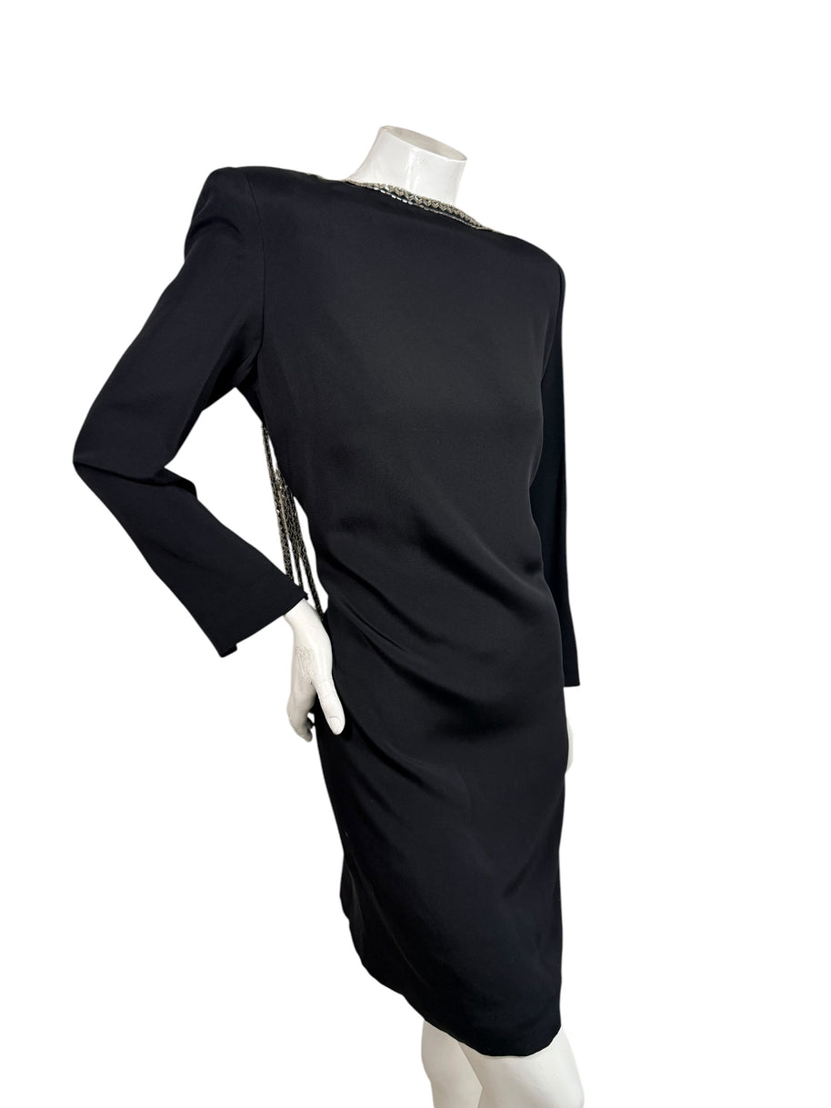 Angled side view of vintage Bob Mackie black cocktail dress with structured shoulders and silver beaded neckline