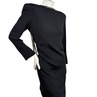 Angled side view of vintage Bob Mackie black cocktail dress with structured shoulders and silver beaded neckline