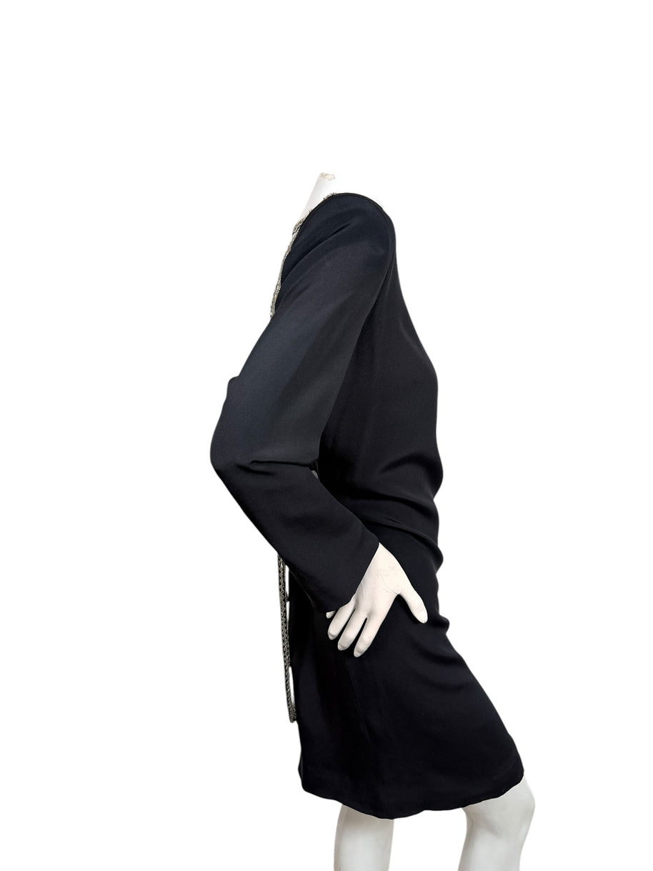 Side profile of vintage Bob Mackie black long sleeve cocktail dress showing fitted knee-length silhouette