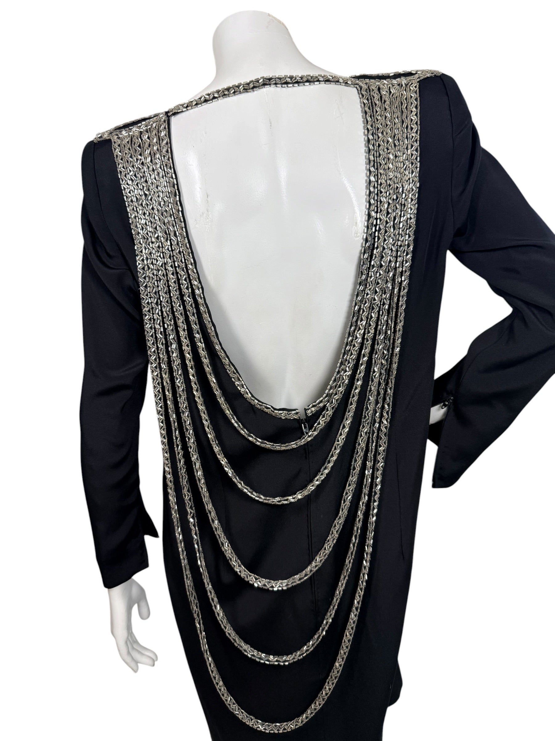 Back view of vintage 1980s Bob Mackie dress with dramatic open back and cascading silver bugle bead strands
