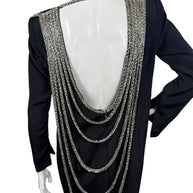 Back view of vintage 1980s Bob Mackie dress with dramatic open back and cascading silver bugle bead strands
