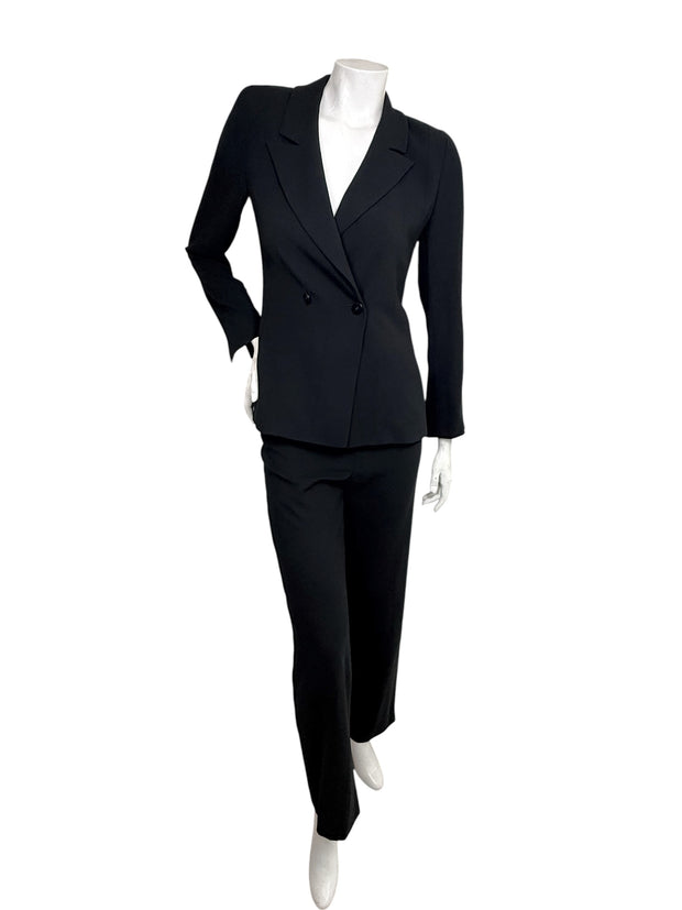 Vintage 1990s Chanel Boutique black pant suit with tailored double-breasted blazer and matching trousers, front view