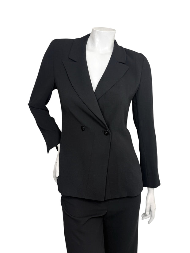 pantsuit-blazer-front-detail.jpg
Vintage Chanel 1990s black pantsuit featuring fitted double-breasted blazer with notched lapels and matching trousers