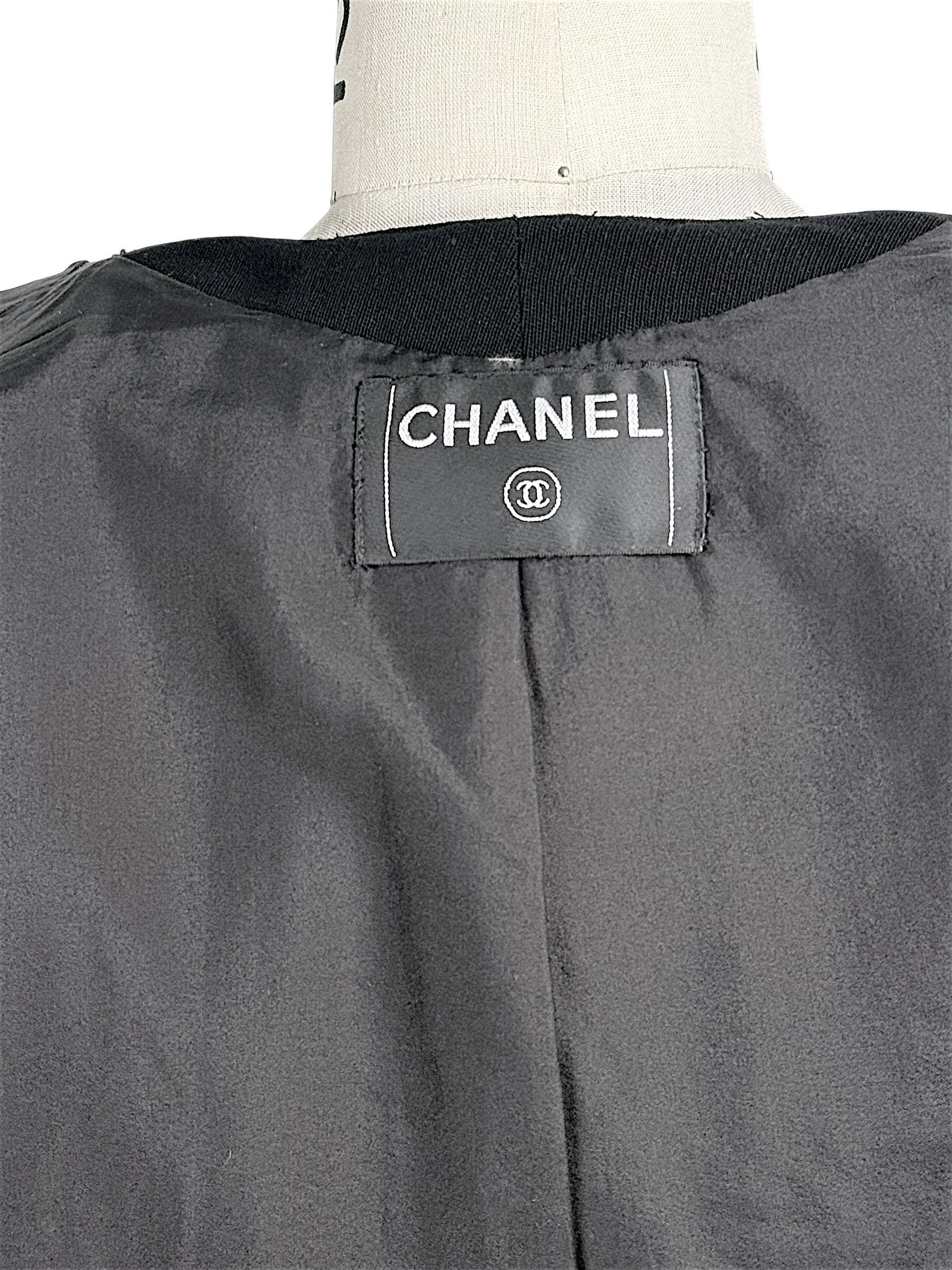 Closeup of vintage Chanel neck label and interior jacket lining detail