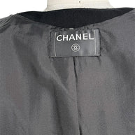 Closeup of vintage Chanel neck label and interior jacket lining detail