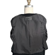 Interior view of vintage Chanel jacket lining with logo label and construction details