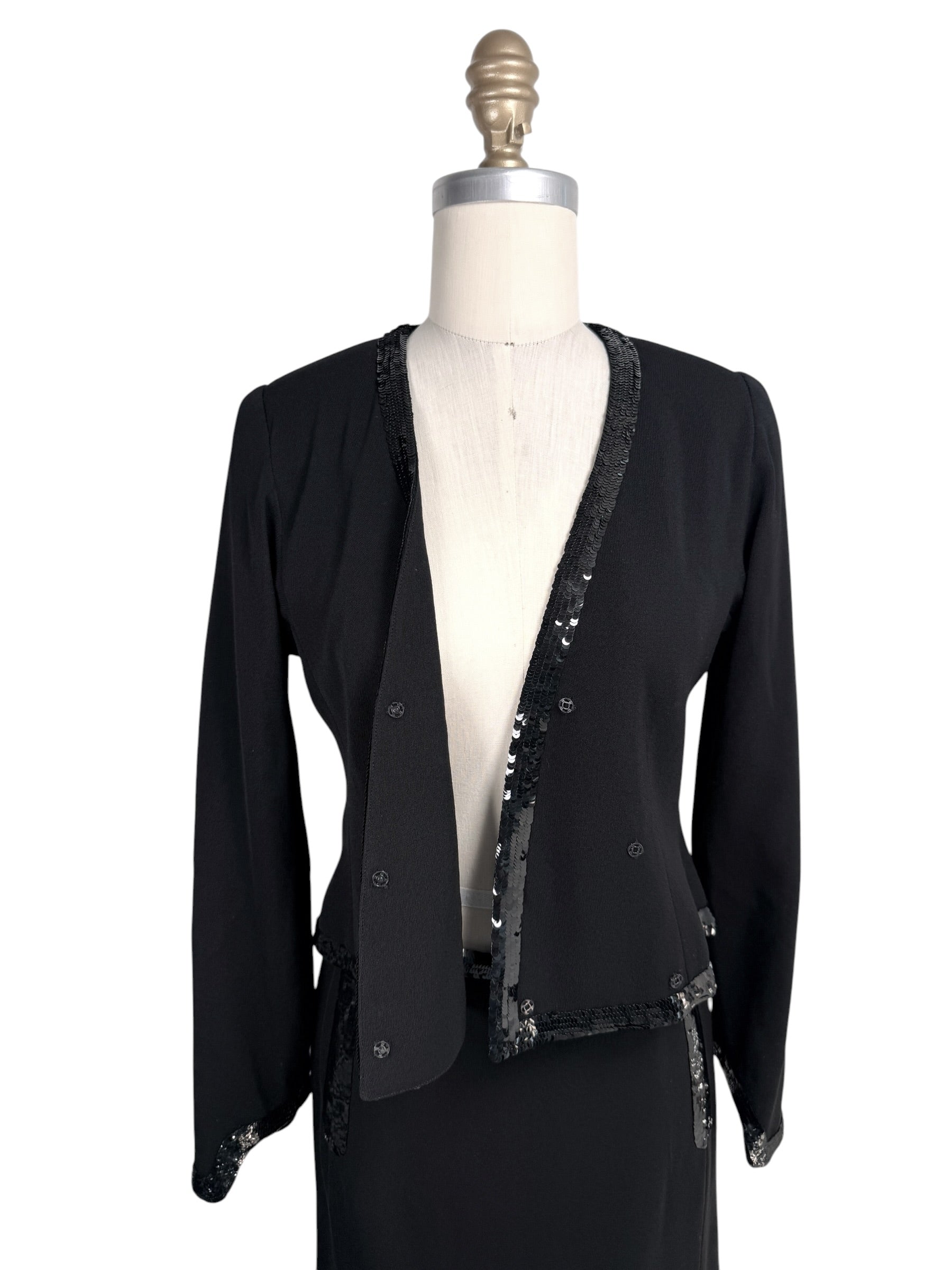 Open front view of vintage Chanel wrap jacket with black sequined trim details