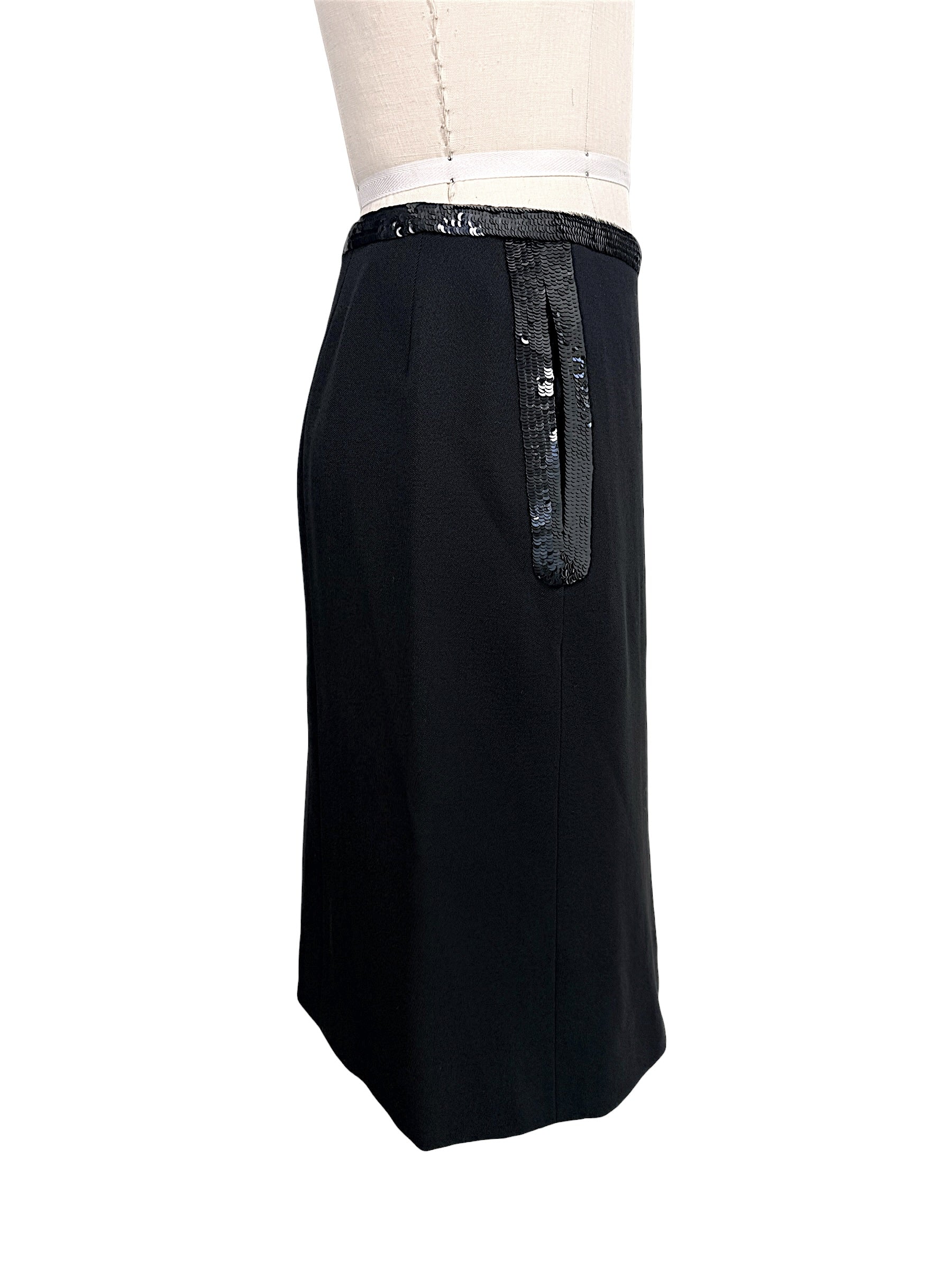 Side profile of vintage Chanel black skirt with elongated sequined trim accents