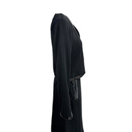 Right side profile of vintage Chanel black sequin trim skirt suit set
