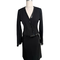 Vintage Chanel black skirt suit set featuring tonal sequin trim with wrap-style jacket and coordinating skirt front view