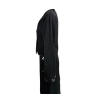 Left side profile of vintage Chanel black skirt suit set with tonal sequin embellishment