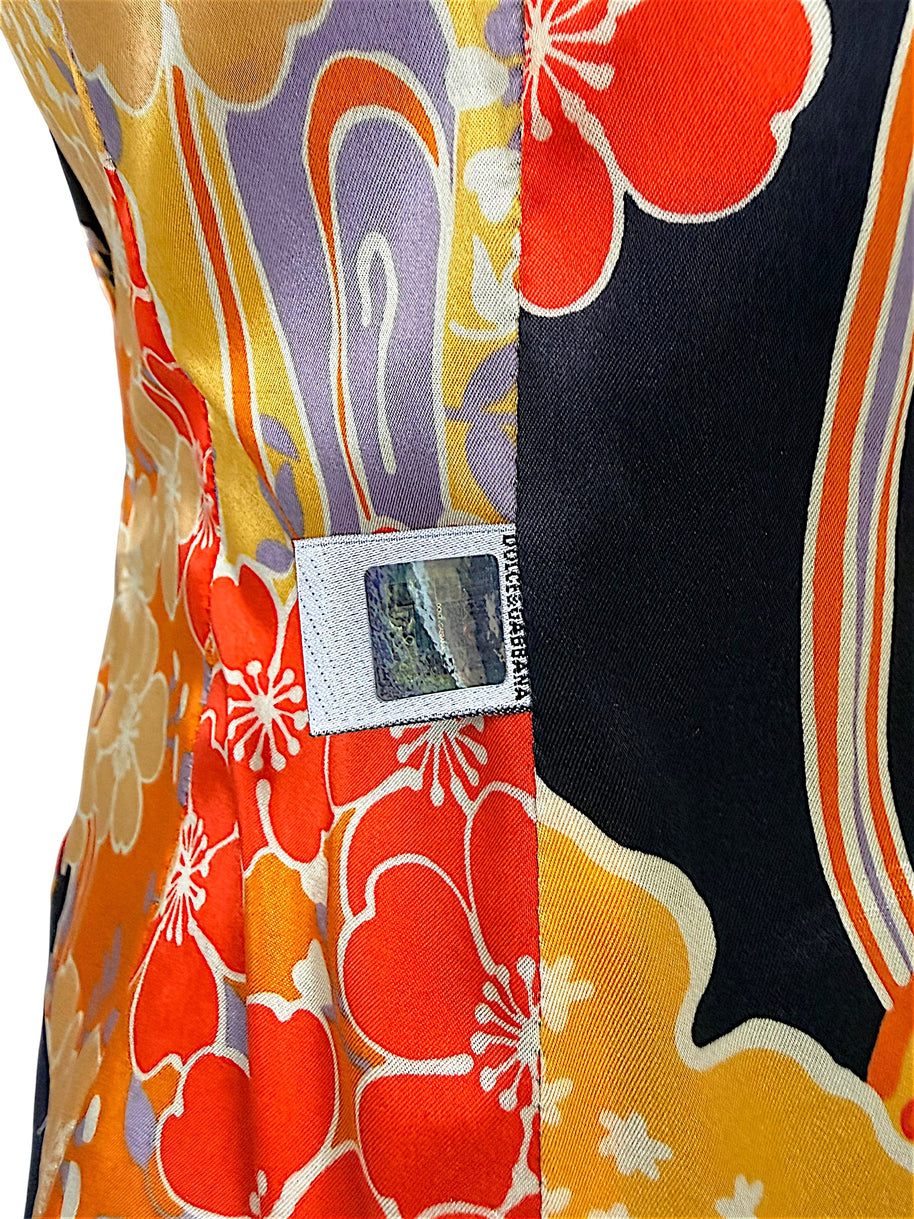 Close-up of Dolce & Gabbana branded security label sewn into the multicolored floral interior lining of a vintage D&G blazer.