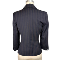 Back view of vintage D&G by Dolce & Gabbana navy pinstripe blazer showing fitted waist, shaped seams and structured shoulders.