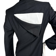 Close-up of the distinctive angular cutout back on a vintage Gianni Versace Couture black blazer, showing the folded panel and precise tailored seams.