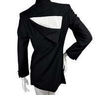 Full back view of vintage Gianni Versace Couture black blazer featuring a dramatic geometric upper-back cutout and sculptural overlapping fabric panel.