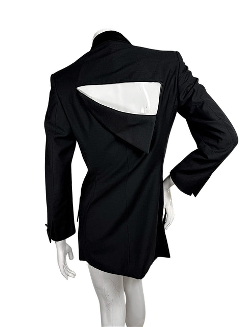 Full back view of vintage Gianni Versace Couture black blazer featuring a dramatic geometric upper-back cutout and sculptural overlapping fabric panel.