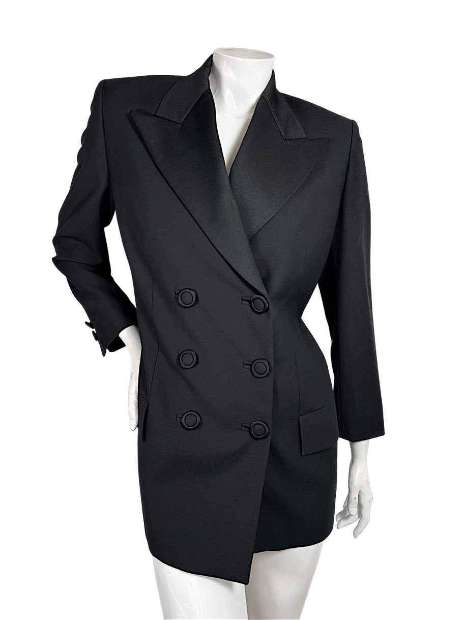 Vintage Gianni Versace Couture black double-breasted blazer with structured shoulders, peaked lapels and six fabric-covered buttons, front view.