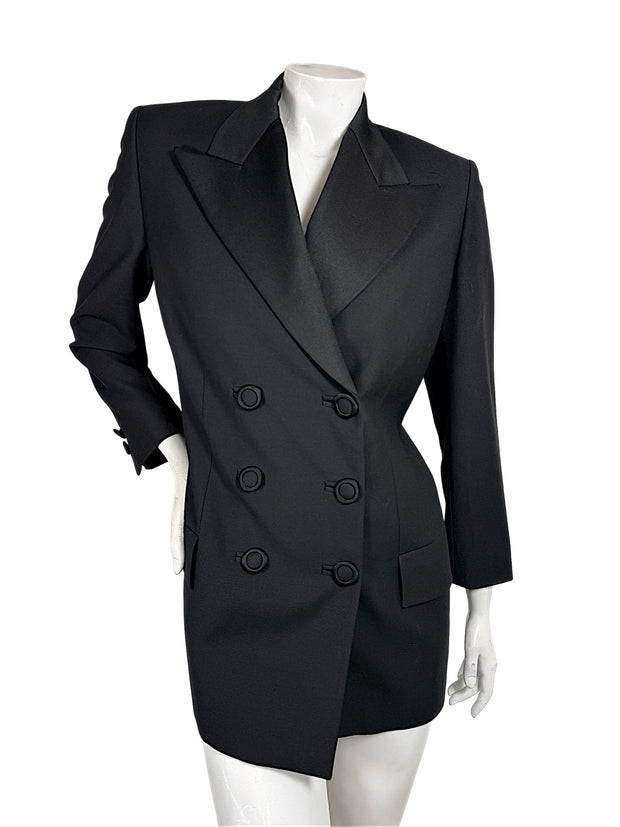 Vintage Gianni Versace Couture black double-breasted blazer with structured shoulders, peaked lapels and six fabric-covered buttons, front view.