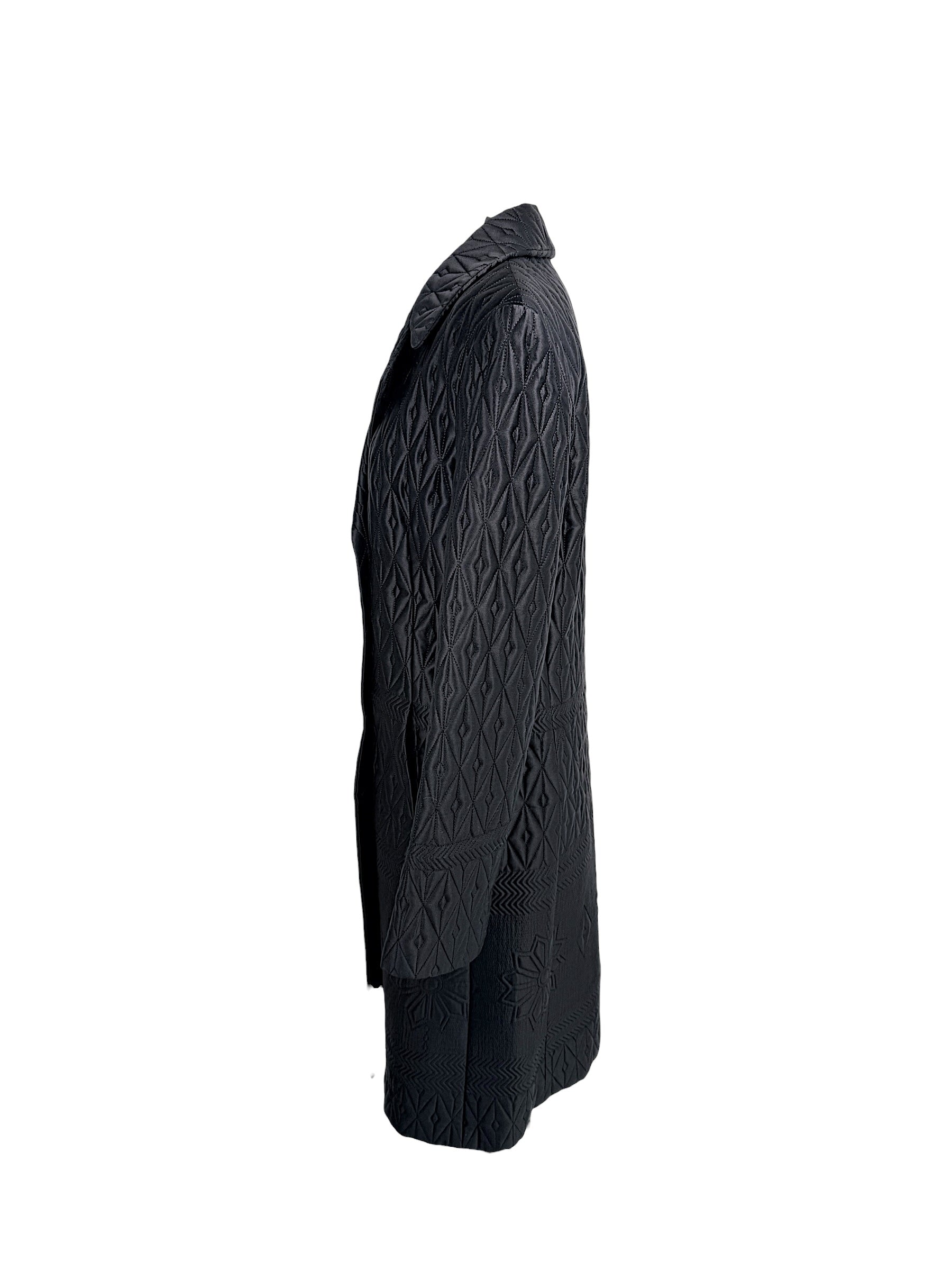 Side profile of vintage Guy Laroche Paris Collection black quilted longline jacket with structured silhouette.