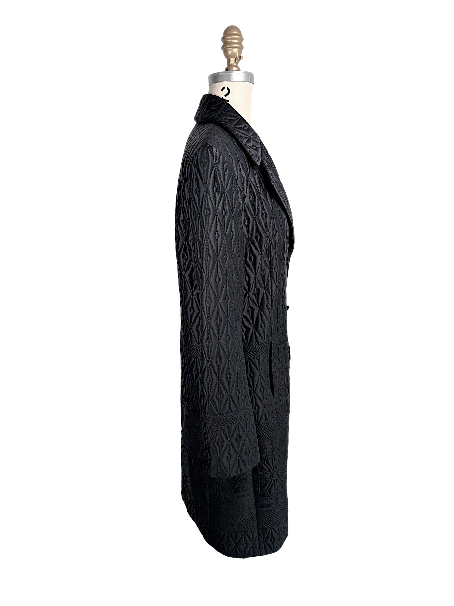 Right side profile of vintage Guy Laroche Paris black quilted longline designer jacket.