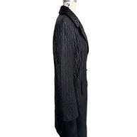 Right side profile of vintage Guy Laroche Paris black quilted longline designer jacket.