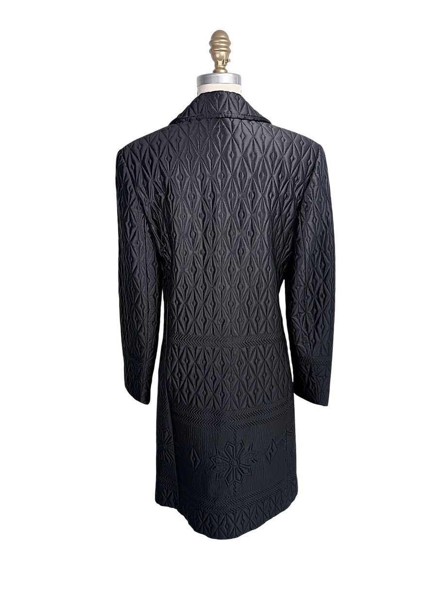 Rear view of vintage Guy Laroche Paris Collection black geometric quilted longline jacket.