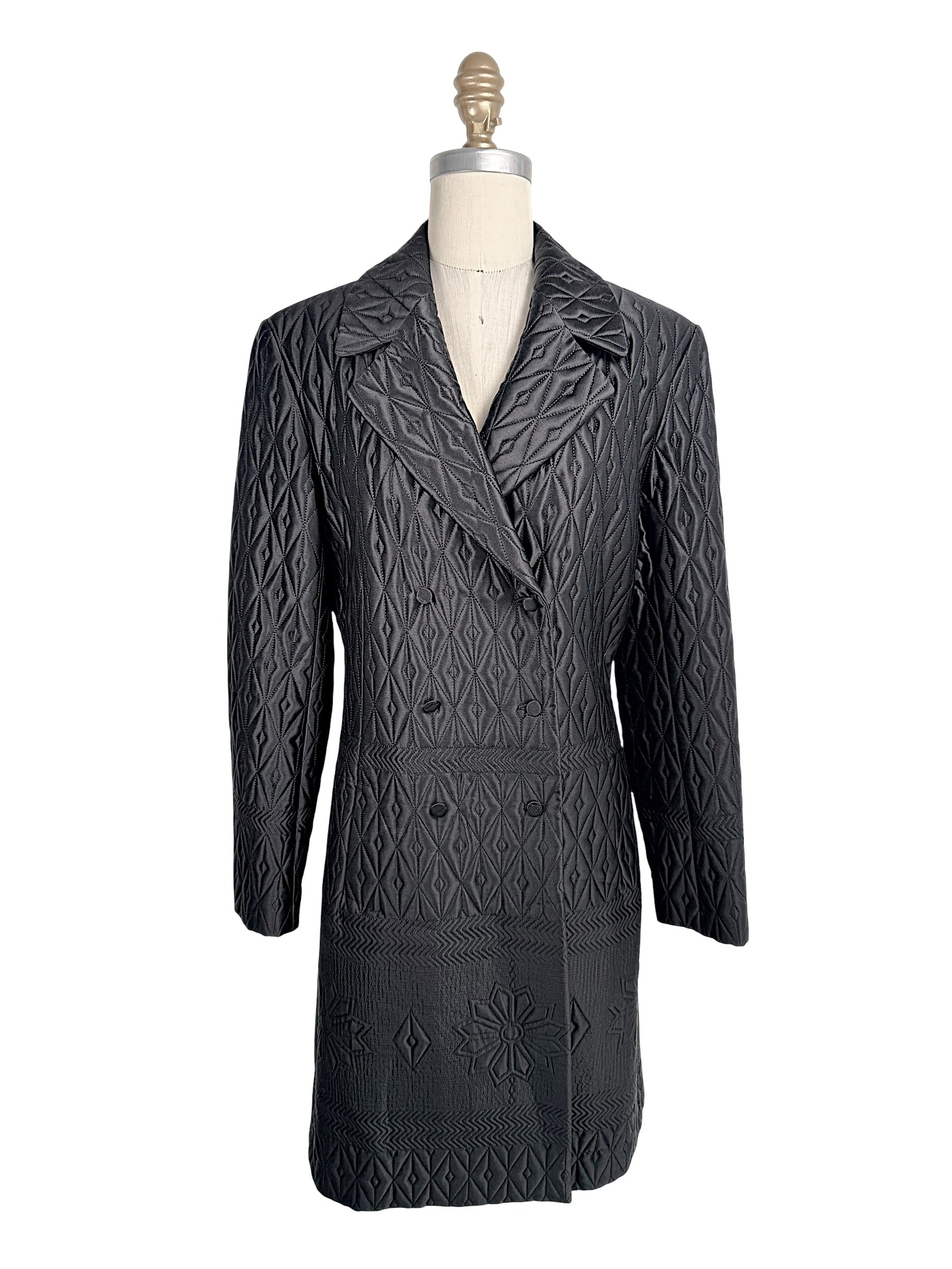 Vintage Guy Laroche Paris Collection black quilted longline double-breasted jacket with geometric stitched pattern front view.