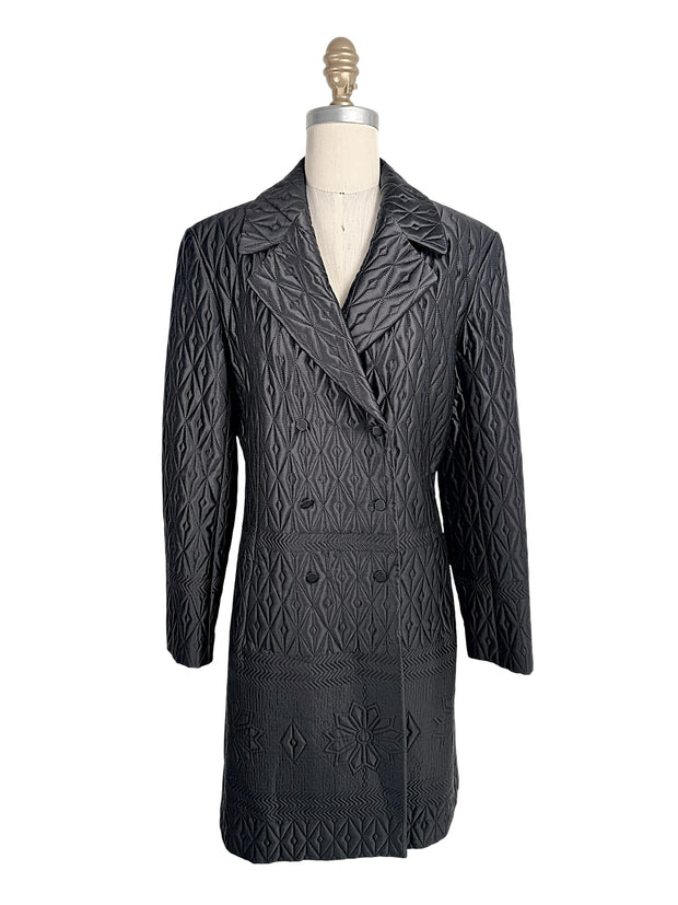 Vintage Guy Laroche Paris Collection black quilted longline double-breasted jacket with geometric stitched pattern front view.