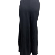 Rear view of vintage Sonia Rykiel Paris black high-waisted wide leg trousers displaying clean tailoring and flowing silhouette.