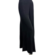 Front angled view of vintage Sonia Rykiel Paris black wide leg trousers highlighting the high-rise waist and elegant silhouette.