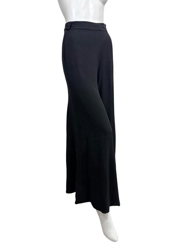 Front angled view of vintage Sonia Rykiel Paris black wide leg trousers highlighting the high-rise waist and elegant silhouette.