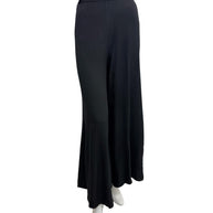 Vintage Sonia Rykiel Paris black high-waisted wide leg trousers photographed from the front on a mannequin, showcasing the fluid drape and minimalist French tailoring.